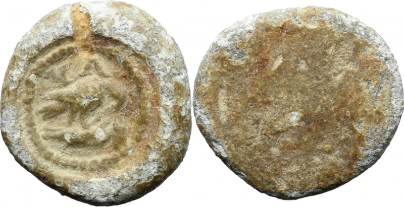 PB Tessera, c. 1st century AD. D/ Eagle (?) standing right, head lowered; below,...