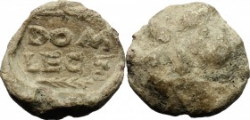 PB Bulla, c. 1st century AD. D/ DOM / LEG / palm branch. R/ Uncertain. PB. g. 16.16 mm. 22.00 VF.