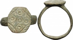 Medieval bronze ring, the bezel engraved with geometric pattern.
 Size 19 mm.
