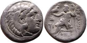 Alexander III (336-323 BC) Drachm Obverse: Head of Herakles to right, wearing lion skin headdress Rev: Zeus seated left on low throne, holding long sc...
