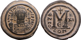 Justinian I (527-565) Follis. Obverse: DN IVSTINIANVS PP AVG, Armoured facing bust holding globus Reverse: Large M between ANNO and regnal year

Wei...