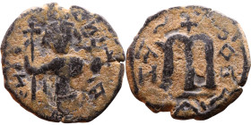 Constans II (641-668) Follis. Obverse: Imperial figure holding cross and globus Reverse: m and inscription

Weight:24mm 4,03g

Artificial sand pat...
