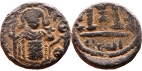 al-Malik ibn Marwan (687-705), Byzantine style folis Obverse: Imperial figure holding globe and cross Reverse: M and inscription

Weight:18mm 4,68g...