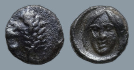 SATRAPS OF CARIA. Hekatomnos. (circa 392/1-377/6 BC)
AR Tetartemorion (5.9mm 0.18g)
Obv: Head of a roaring lion to left.
Rev: Head of Apollo (?) fa...