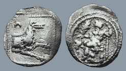 LYCAONIA. Laranda. (Circa 324/3 BC)
AR Obol (13,6mm 0,5g)
Obv: Baaltars seated left, holding grain ear and grape bunch in his right hand and scepter...