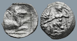 LYCAONIA. Laranda. (Circa 324/3 BC)
AR Obol (12,1mm 0,6g)
Obv: Baaltars seated left, holding grain ear and grape bunch in his right hand and scepter...