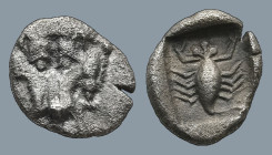 CARIA. Mylasa. (Circa 450-400 BC).
AR Hemiobol (6,7mm 0,34g)
Obv: Facing forepart of lion.
Rev: Scorpion within incuse square.
HN online 973; SNG ...