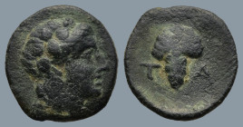 AEOLIS. Temnos. (3rd century BC).
AE Bronze (12,9mm 1,4g)
Obv: Head of Dionysos right, wearing ivy wreath.
Rev: T - A. Grape bunch on vine.
SNG Co...