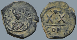 Phocas (602-610 AD). Constantinople.
AE Half Follis (25,9mm 7,1g)
Obv: Crowned bust facing, wearing consular robes, holding mappa and cross.
Rev: L...
