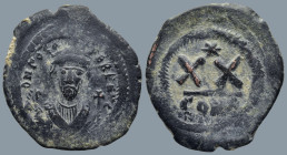 Phocas (602-610 AD). Constantinople.
AE Half Follis (25,9mm 6,7g)
Obv: Crowned bust facing, wearing consular robes, holding mappa and cross.
Rev: L...