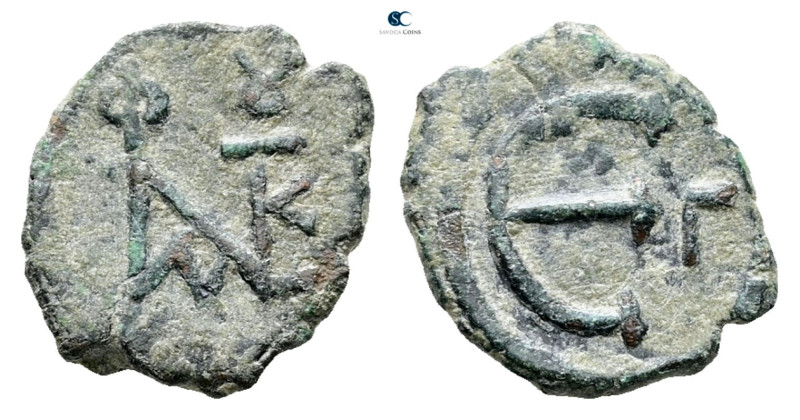 Justin II AD 565-578. Constantinople
Pentanummium Æ

16 mm, 1,61 g



Ver...