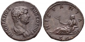 Adriano. Sestercio. 136 d.C. Roma. (Spink-3603). (Ric-851). Rev.: HISPANIA SC. Hispania tumbada a izquierda con una rama. Ae. 24,86 g. Campos suavizad...