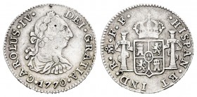 Carlos III (1759-1788). 1/2 real. 1770. México. FF. (Cal-no cita). Ag. 1,67 g. Busto de Carlos III y en leyenda CARLOUS IV. Marcas de punzón. Inédita....