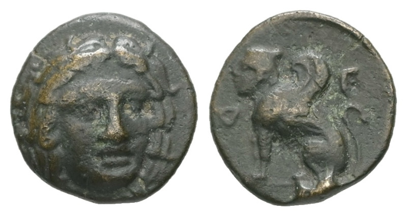 Caria, Kaunos. AE. 0.90 g. - 10.26 mm. Circa 386-300 BC.
Obv.: Facing head of Ap...