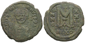 Justinian I. AD. 527-565. AE Follis. 17.39 g. - 34.43 mm. Nicomedia.
Obv.: DNIVSTINI-ANVS PPAVC. Frontal bust of Justinian I wearing helmet with plume...