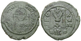 Justinian I. AD. 527-565. AE Follis. 20.95 g. - 35.31 mm. Nicomedia.
Obv.: D[NIV]STINI-ANVS PPAVC. Frontal bust of Justinian I wearing helmet with plu...