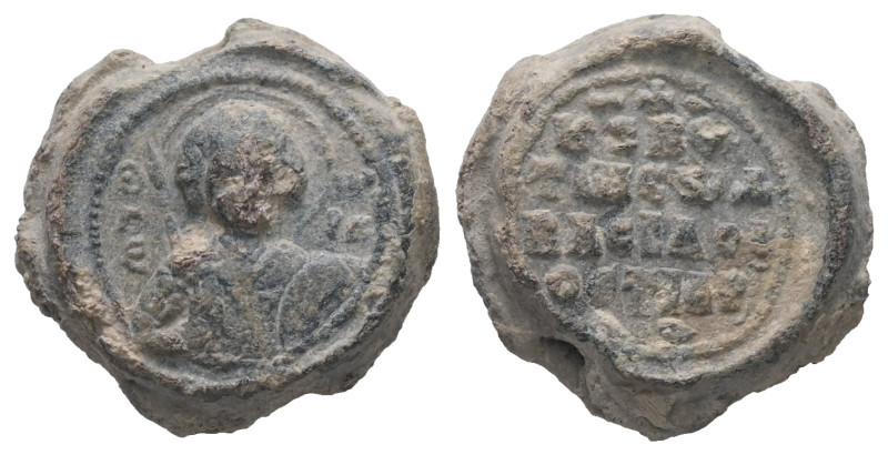 PB Byzantine seal of Basil ostiarios (AD 11th century)
Obv.: Half-length of St G...