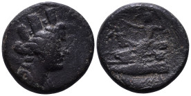 PHOENICIA. Arados. Circa 130-129 BC. Obv: Turreted and draped bust of Tyche right, palm over shoulder. Rev: Poseidon seated left on prow, crowning Ath...