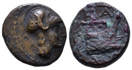 KINGS of MACEDON. Demetrios I Poliorketes. 306-283 BC. Æ Half Unit. Tarsos mint. Struck circa 298-295 BC. Obv: Helmeted head of male right. Rev: Prow ...