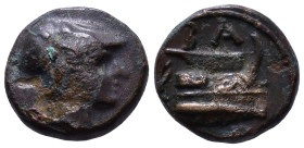 KINGS of MACEDON. Demetrios I Poliorketes. 306-283 BC. Æ Half Unit. Tarsos mint. Struck circa 298-295 BC. Obv: Helmeted head of male right. Rev: Prow ...