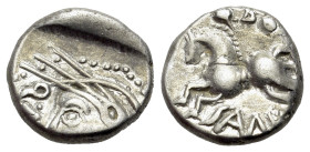 Central Gaul, Sequani, c. 100-50 BC. AR Quinarius (13mm, 1.97g, 9h). Helmeted head to l.t; Q • DOC[I] to l. R/ Horse to l.; [Q • DOCI] above, SAM F be...