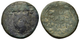 Macedon. Roman Protectorate (166-165 BC). Æ (20,5mm, 7.9g). Uncertain mint. Facing mask of Silenos wearing ivy wreath. R/ Legend in two lines; D above...
