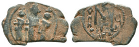 Arab-Byzantine. Imitating Constans II. Ca. 7th-8th centuries A.D. AE fals. Tabariya. The Byzantine emperor Constans and sons standing facing / Large M...