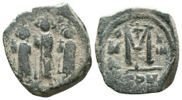 Arab-Byzantine. Imitating Constans II. Ca. 7th-8th centuries A.D. AE fals. Tabariya. The Byzantine emperor Constans and sons standing facing / Large M...