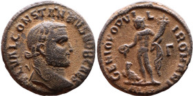 Constantius I (293-306 ). AE follis. Obv.Laureate head right. Rev.: Genius standing left pouring libations from patera, holds cornucopia
