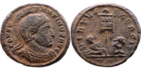 Constantinus I (306-337) follis. Obv: helmeted, cuirassed bust right. Rev: VIRTVS-EXERCIT, two captives seated at the base of a standard inscribed VOT...