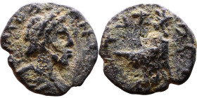 Roman Provincial
ARABIA, Adraa. Commodus. AD 177-192.  Laureate, draped, and cuirassed bust right / Tyche seated left on rocks, head right; below, th...