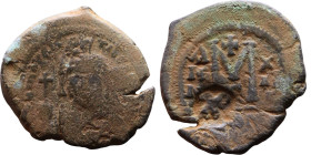 Maurice Tiberius (582-602) Follis. Obverse: Helmeted and cuirassed bust facing, holding globus cruciger and shield., Reverse: Large M above cross, ANN...