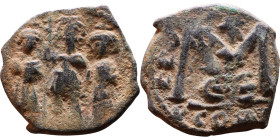 Justinian I (527-565) Decanummium. Obverse: DN IVSTINIANVS PP AVG, Armoured facing bust holding globus Reverse: Large I between ANNO and regnal year