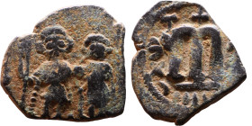 Constans II (641-668) Follis. Obverse: Imperial figure holding cross and globus Reverse: m and inscription