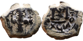 Constans II (641-668) Follis. Obverse: Imperial figure holding cross and globus Reverse: m and inscription