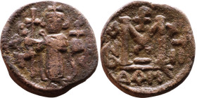 al-Malik ibn Marwan (687-705), Byzantine style folis Obverse: Imperial figure holding globe and cross Reverse: M and inscription