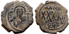 Phocas (602-610) Follis. Obverse: DN FOCA PERP AVG Crowned bust facing, wearing consular robes, holding mappa and eagle-tipped scepter , Reverse: Larg...
