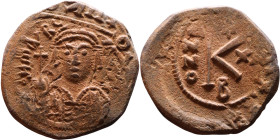 Maurice Tiberius (582-602) Half Follis. Obverse: Helmeted and cuirassed bust facing, holding globus cruciger and shield., Reverse: Large K above cross...