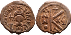 Maurice Tiberius (582-602) Half Follis. Obverse: Helmeted and cuirassed bust facing, holding globus cruciger and shield., Reverse: Large K above cross...