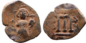 Constans II (641-668) Follis. Obverse: Imperial figure holding cross and globus Reverse: m and inscription