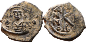 Maurice Tiberius (582-602) Half Follis. Obverse: Helmeted and cuirassed bust facing, holding globus cruciger and shield., Reverse: Large K above cross...