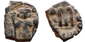 Constans II (641-668) Follis. Obverse: Imperial figure holding cross and globus Reverse: m and inscription