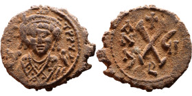 Maurice Tiberius (582-602) Half Follis. Obverse: Helmeted and cuirassed bust facing, holding globus cruciger and shield., Reverse: Large XX above cros...