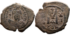 Maurice Tiberius (582-602) Follis. Obverse: Helmeted and cuirassed bust facing, holding globus cruciger and shield., Reverse: Large M above cross, ANN...