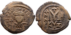 Heraclius (610-641) Follis. Obverse: Helmeted and cuirassed bust facing, holding globus cruciger and shield., Reverse: Large M above cross, ANNO