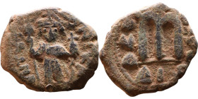 Constans II (641-668) Follis. Obverse: Imperial figure holding cross and globus Reverse: m and inscription