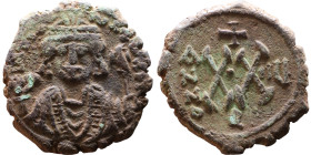 Maurice Tiberius (582-602)  Half Follis Obverse: Crowned bust facing, wearing consular robes, holding mappa and eagle-tipped scepter , Reverse: Large ...