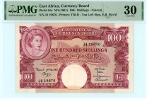 East Africa
East African Currency Board
100 Shillings, ND (1961)
S/N J4 19676
Printer: TDLR
Pick 44a; TBB 230

Graded Very Fine 30 PMG.

From the “Yan...