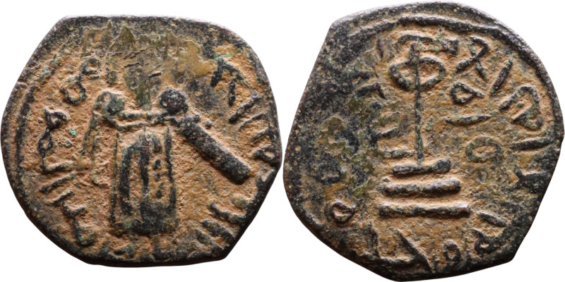 al-Malik ibn Marwan (687-705) Follis. Obverse: Standing caliph Reverse: Modified...