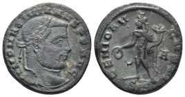 Galerius BI Nummus. Siscia, AD 309-310. (7 Gr. 23mm.)
Laureate head to right 
Rev. Genius, wearing modius on head, standing to left, holding patera an...